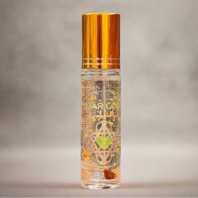 Essential oil roll on bottle with gold cap. Crystal inside. Star Code Alchemy based in Sedona.